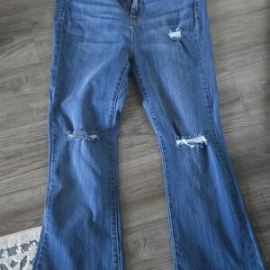 Fashion Nova Blue Flare Jeans with Distressed Details